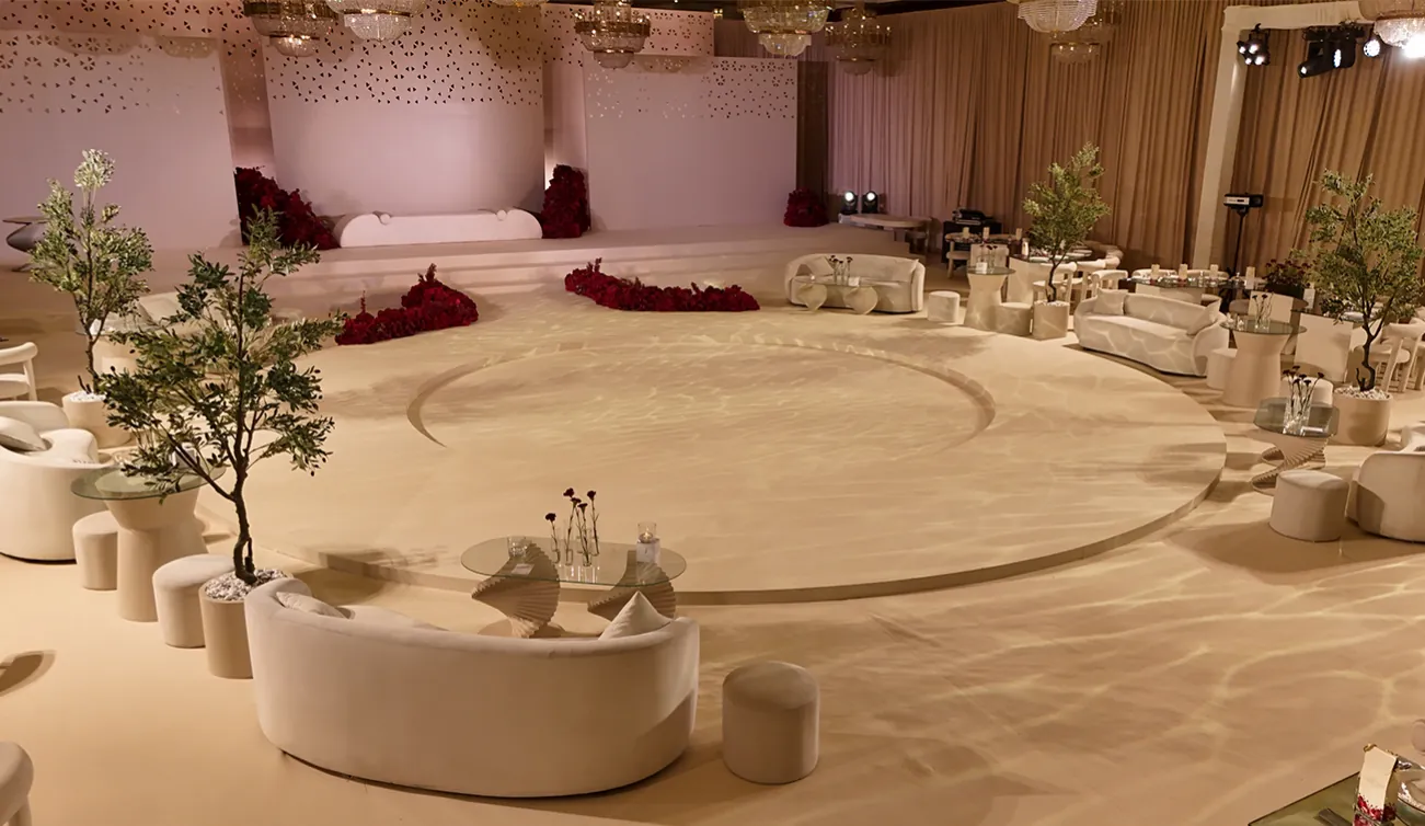 Blush wedding hall with lounge seating and trees