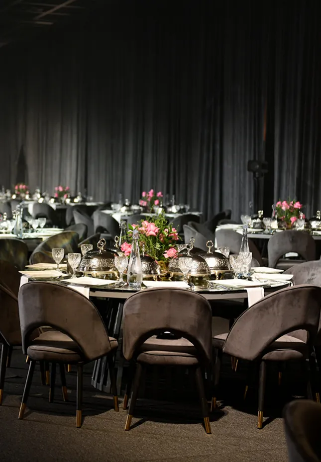 Round guest table with velvet chairs